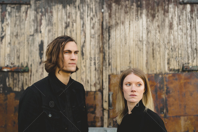 Man and woman looking away