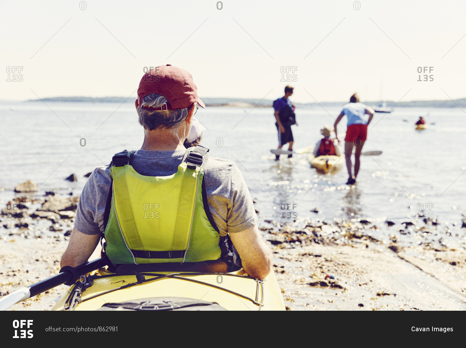 Family prepares to go kayaking in Casco Bay, Maine after renting kayak