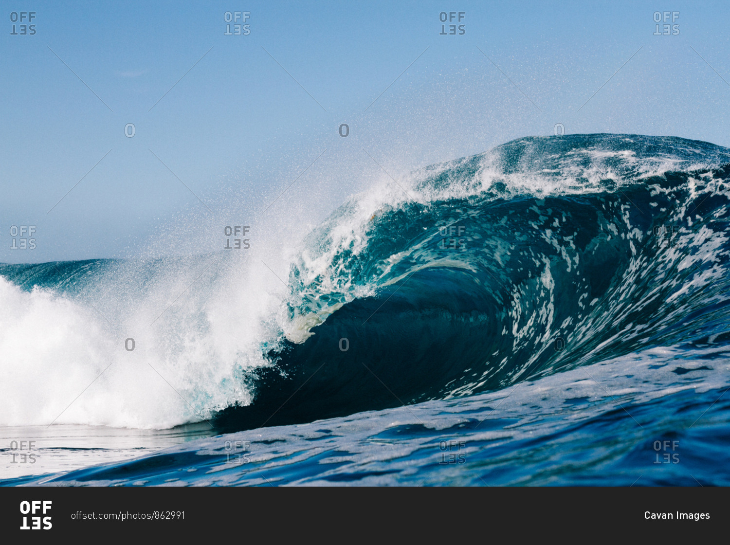 blue wave breaking in the Atlantic Ocean stock photo - OFFSET