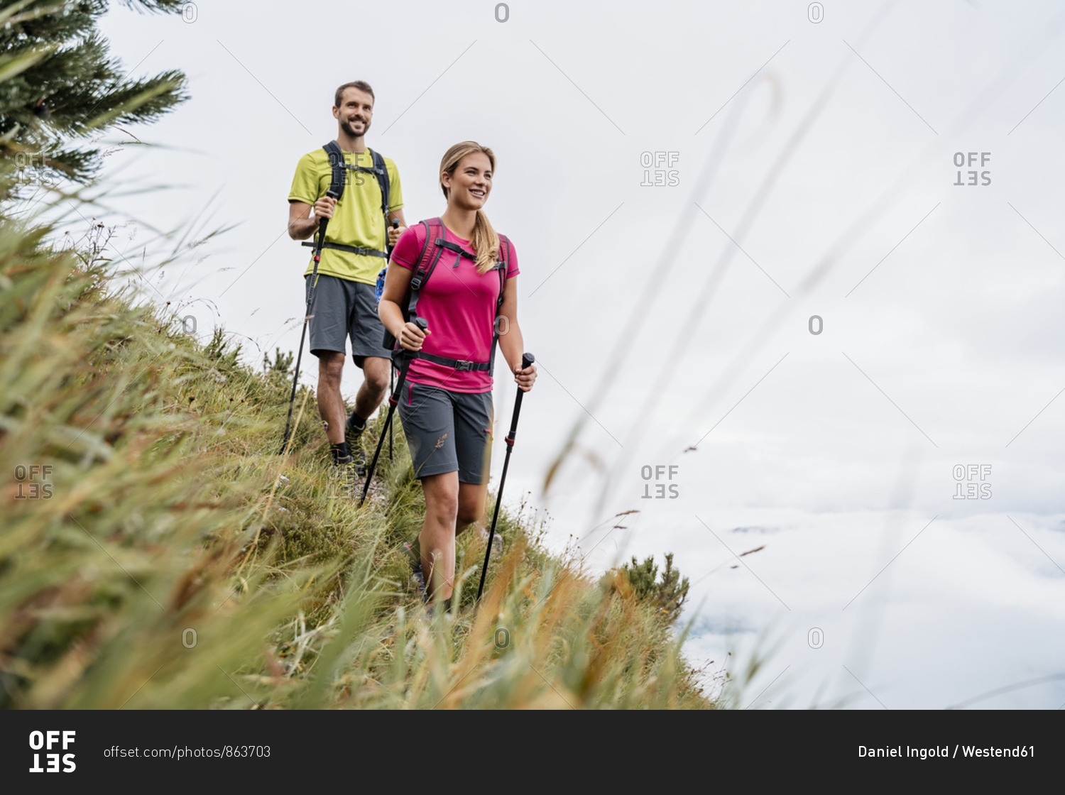 Confident young couple on a hiking trip in the mountains- Herzogstand- Bavaria- Germany