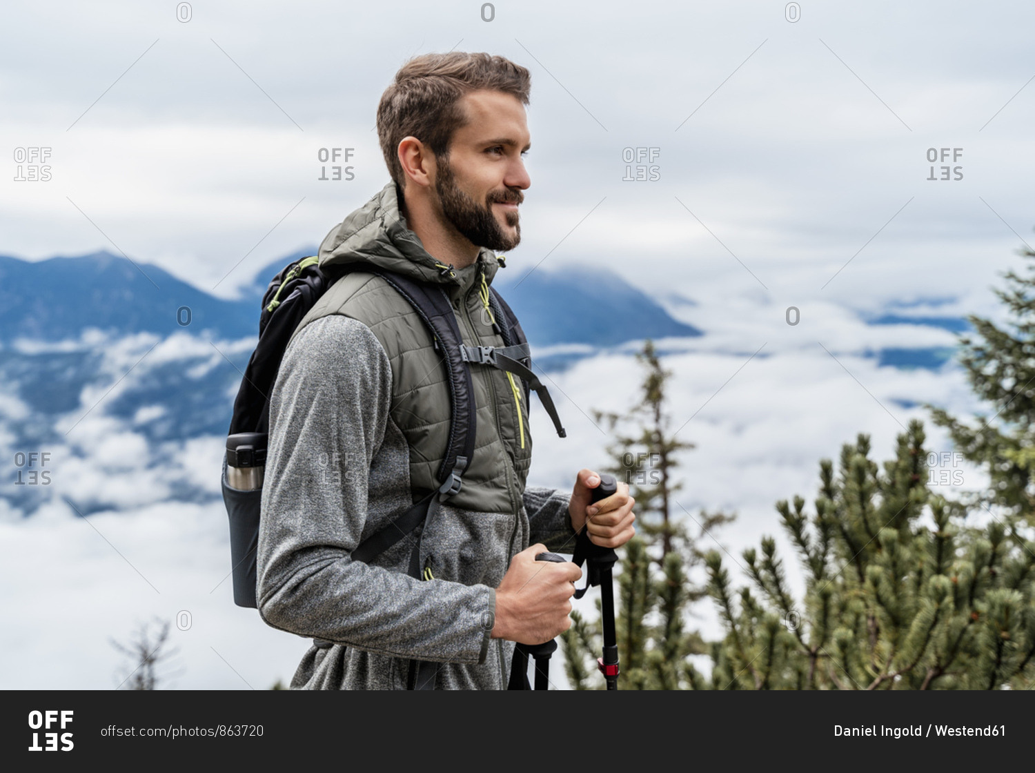 Confident young man on a hiking trip in the mountains- Herzogstand- Bavaria- Germany