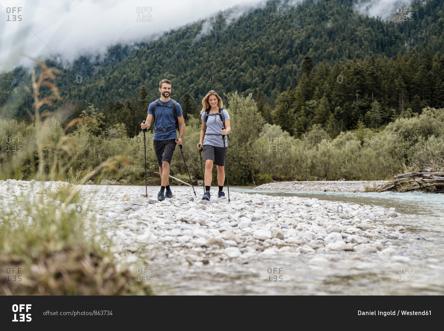 Young couple on a hiking trip at riverside- Vorderriss- Bavaria- Germany
