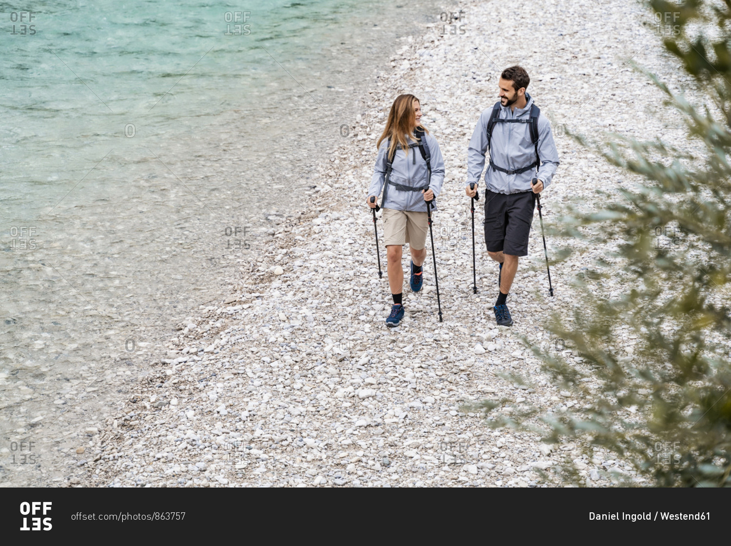 Young couple on a hiking trip walking at the riverside- Vorderriss- Bavaria- Germany