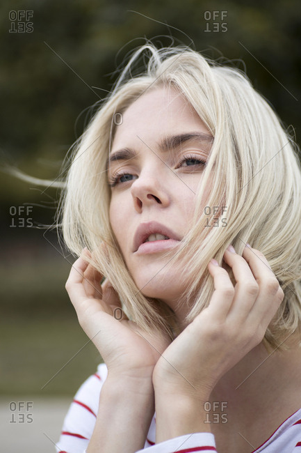 Portrait of daydreaming young  woman outdoors