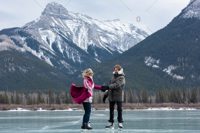 Couple dancing while standing in snowy landscape