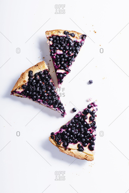 Pieces of summer tart with fresh blueberries