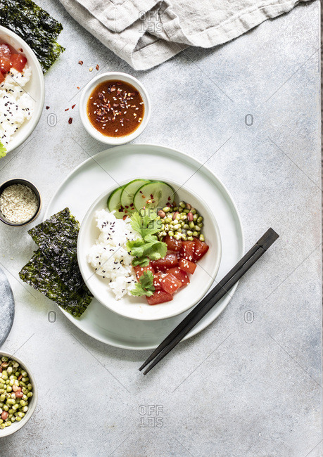 Sauteed watermelon poke bowl served with rice, cucumbers, and sprouted adzuki, lentil and beans