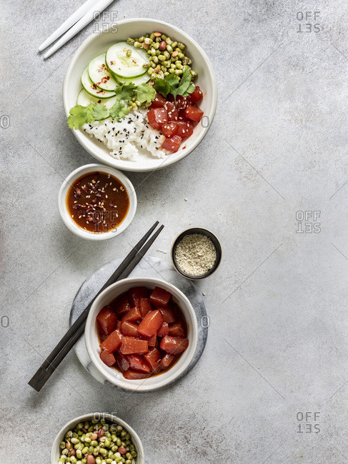 Sauteed watermelon poke bowl served with rice, cucumbers, and sprouted adzuki, lentil and beans
