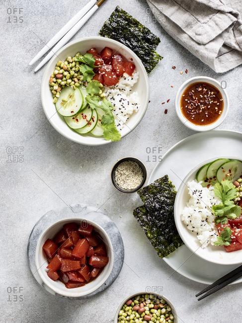Sauteed watermelon poke bowl served with rice, cucumbers, and sprouted adzuki, lentil and beans