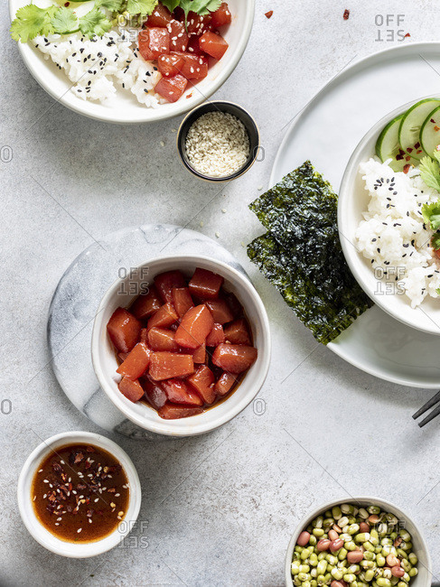 Sauteed watermelon poke bowl served with rice, cucumbers, and sprouted adzuki, lentil and beans