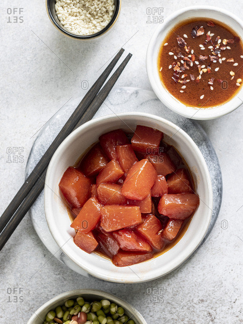 Sauteed watermelon poke bowl served with rice, cucumbers, and sprouted adzuki, lentil and beans