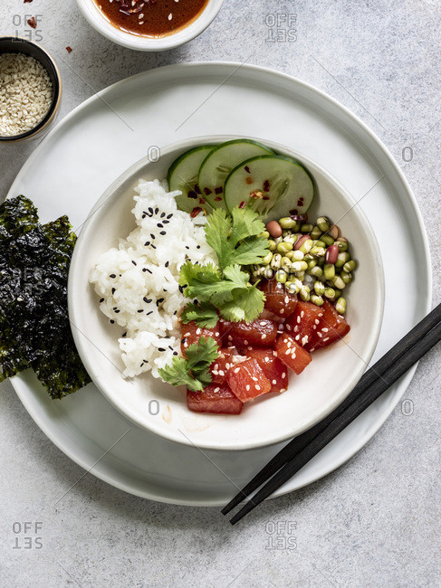 Sauteed watermelon poke bowl served with rice, cucumbers, and sprouted adzuki, lentil and beans
