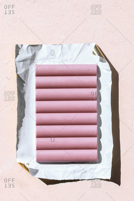 Ruby chocolate bar on a piece of paper