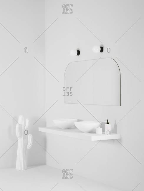 Ceramic bowl placed on simple shelf against white wall in bathroom with mirror