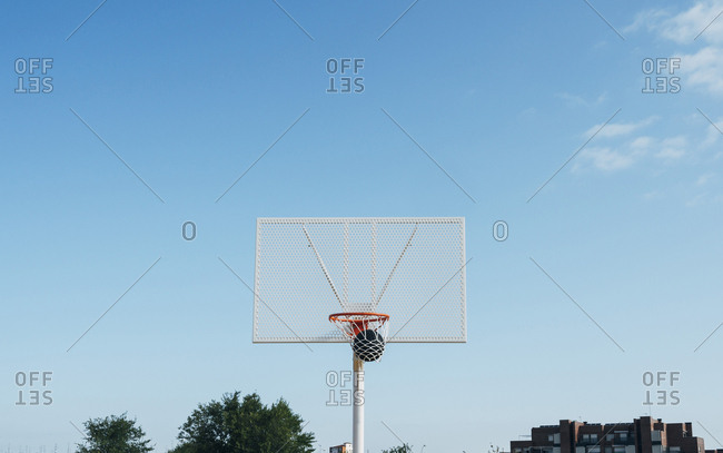 ball into basket in Outdoor basketball court and black ball