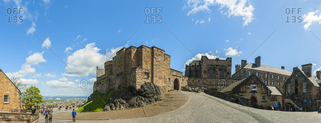 May 22, 2013: United Kingdom, Scotland, Edinburgh . Edinburgh Castle is a historic fortress which dominates the skyline of the city of Edinburgh, from its position on the Castle Rock. Archaeologists have established human occupation of the rock since at least the Iron Age, although the nature of the early settlement is unclear.