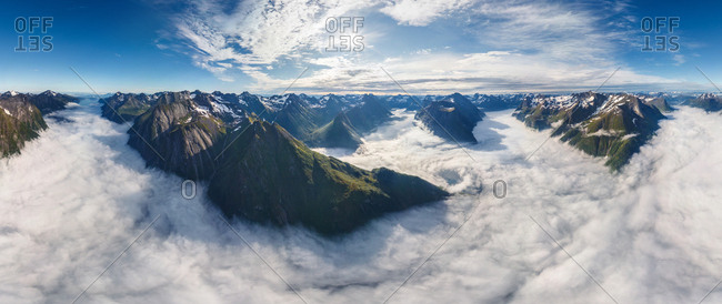 Aerial view of mountain chain above the clouds, Norway.