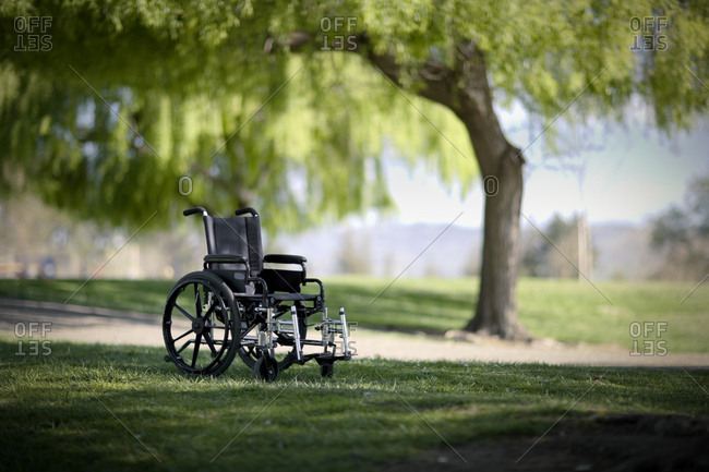 Empty wheelchair in a park.