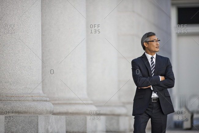 Businessman standing in street.