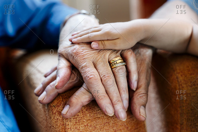 Elderly couple and baby's hand- generations together