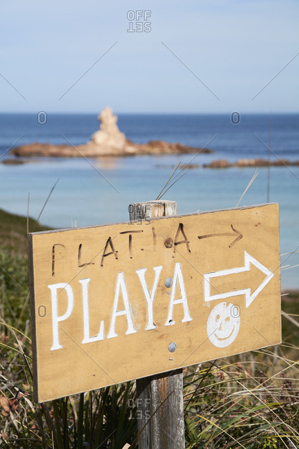 Close-up of beach sign against sky during sunny day- Menorca- Spain
