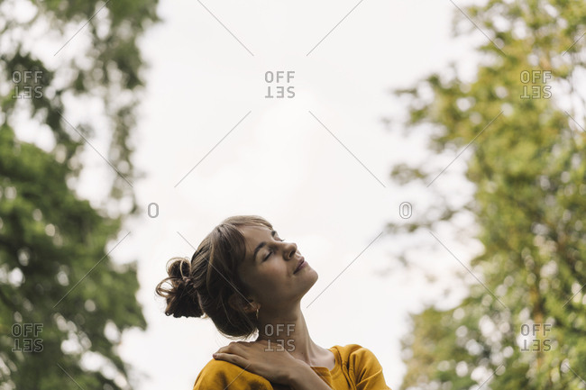 Relaxed young woman in a park