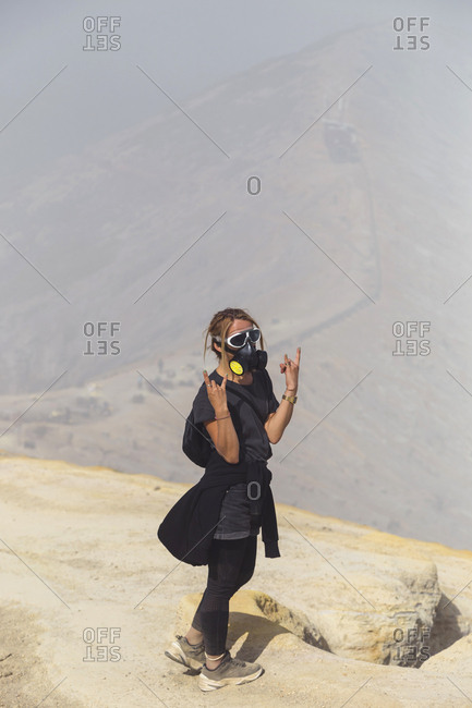 Young woman with aspirator mask at Ijen volcano- Java- Indonesia