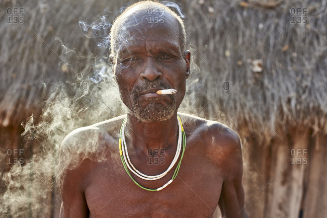 Traditional Mudimba tribe man smoking- Mudimba tribe- Canhimei- Angola