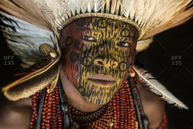 Brazil, Bahia - July 28, 2016: Indigenous with face painting and traditional clothes