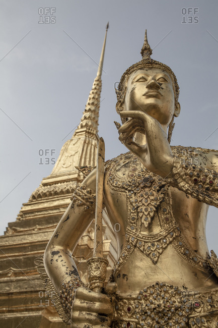 Golden statue of Kinnari inside the Grand Palace