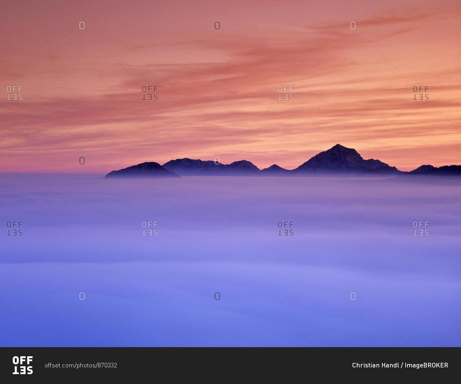 Sunset and fog in the valley Steiner mountain range Carinthia Austria