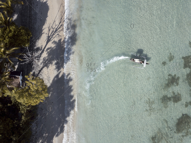 Aerial view of boat with surfboards, Sumbawa, Indonesia