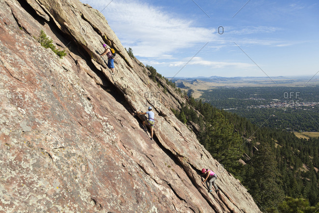 United states, colorado, boulder - august 26, 2018: people rock climb third flatiron east face above boulder, colorado