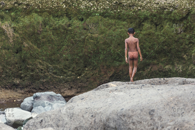 Asian boy near river