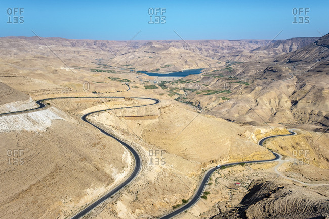 Highway 35 through desert landscape near mujib reservoir, jordan