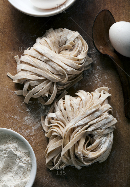 Homemade fresh pasta rolled and drying on cutting board