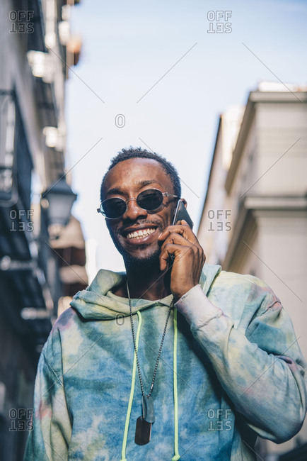 Portrait of grinning man on the phone