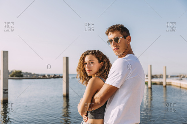 Portrait of young couple hugging at the sea