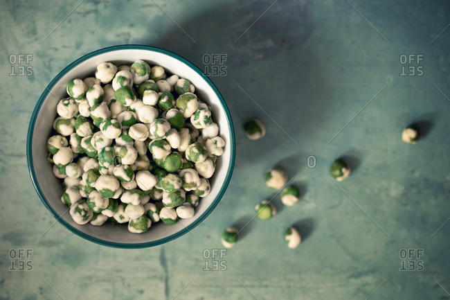 A bowl of wasabi peas, a spicy Japanese savory snack of dried green peas with a wasabi horseradish coating.