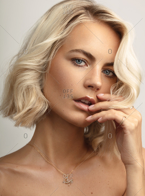 Close-up beauty portrait of a young blond woman