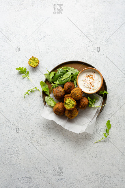 Overhead view of falafel and sauce