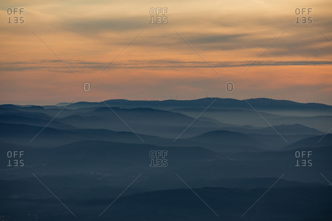 Beautiful orange sunset over rolling hills in Portugal