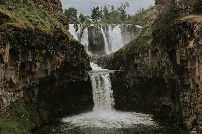 Scenic view of waterfall over rock formations