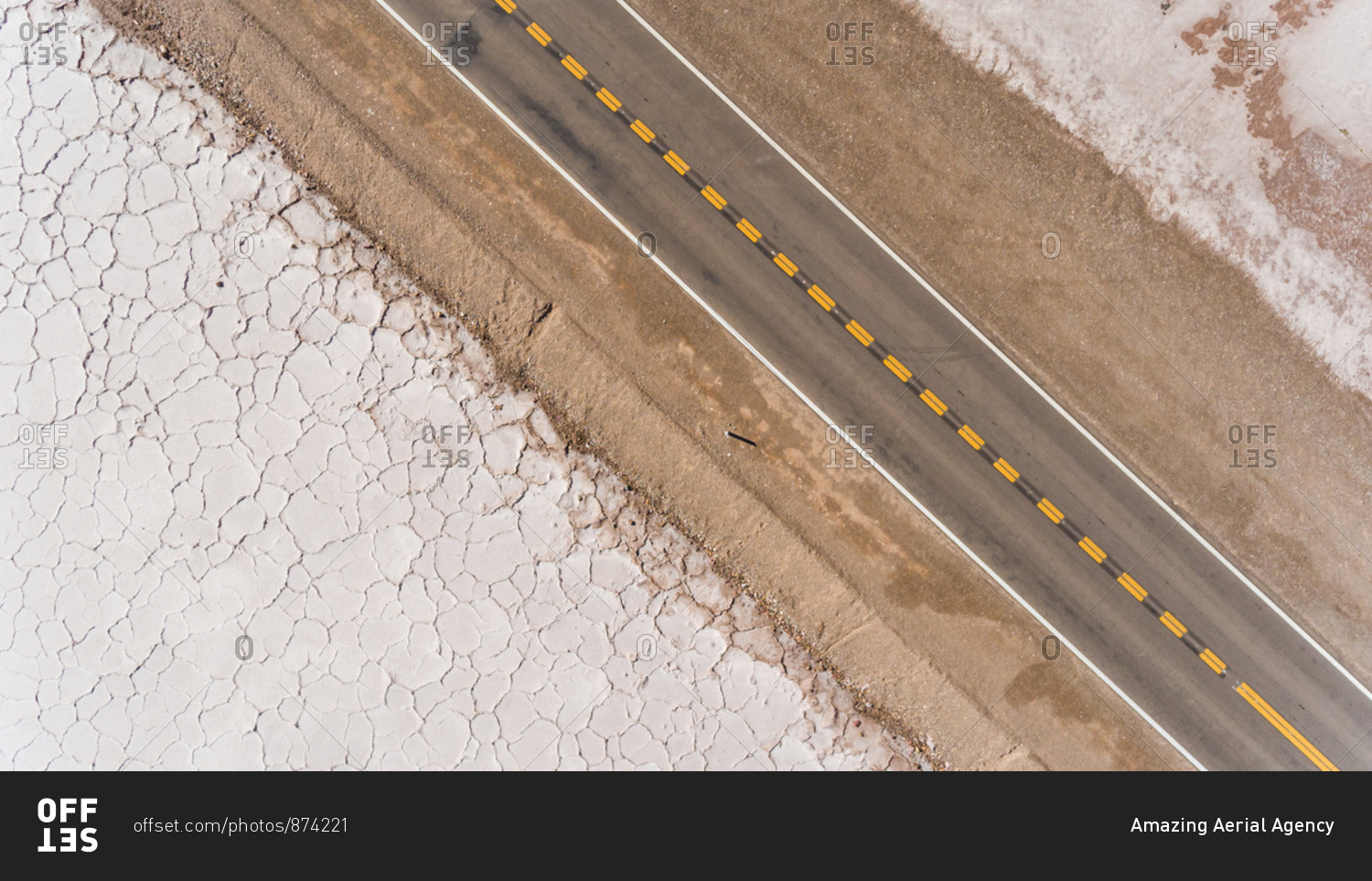 Aerial view of road crossing Salinas Grande, touristic attraction, Argentina.