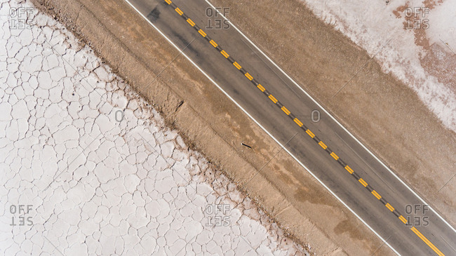 Aerial view of road crossing Salinas Grande, touristic attraction, Argentina.