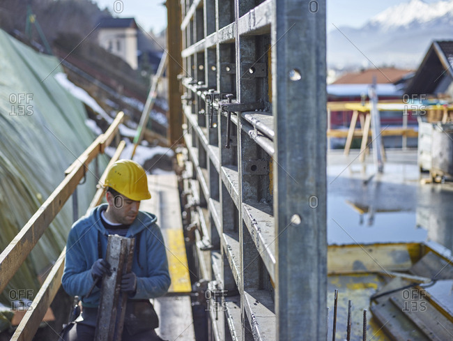 Construction worker working on plywood