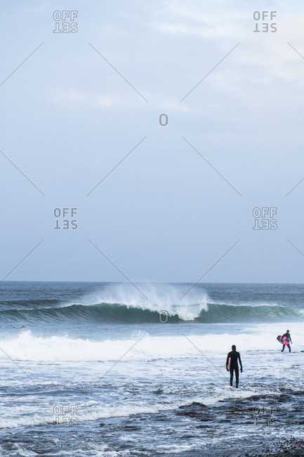 Surfers exploring the coast of Ireland on a surf trip