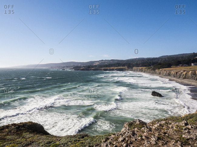 Scenic view of sea against clear sky during sunny day