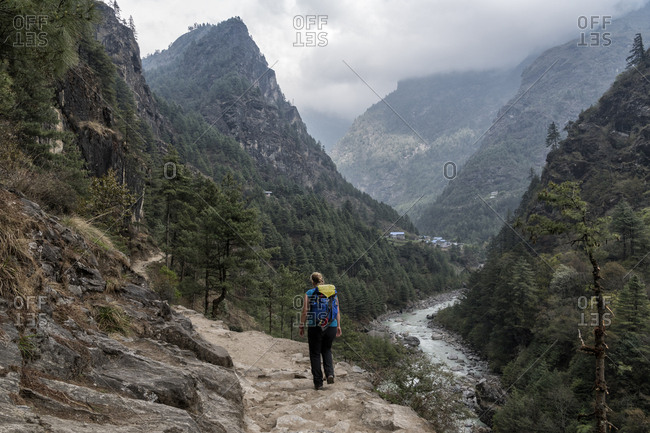 Young woman trekking in the Himalayas near Manjo- Solo Khumbu- Nepal