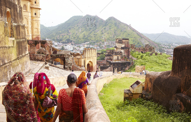 Jaipur, India - August 27, 2013: Rear view of women walking down steps at the Amer Fort